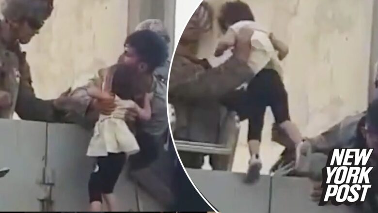 Video shows child being hoisted over wall amid Kabul airport chaos | New York Post