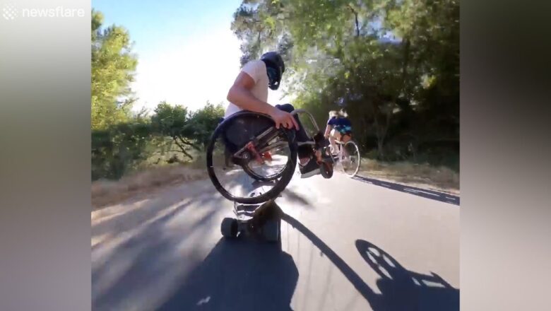 California man skillfully rides a longboard while in a wheelchair