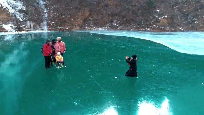 Tourists flock to get glimpse of stunning frozen waterfalls