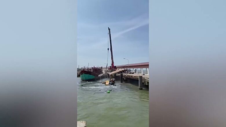 Driver escapes as crane falls into sea after cables snap!