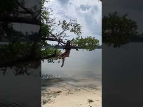 Woman Jumps Off Tree and has a Swimsuit Fail