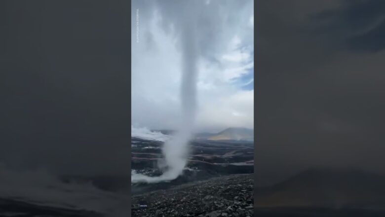 Adventure photographer captures funnel cloud tornado on Iceland volcano | USA TODAY #Shorts