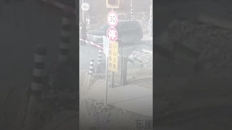 Car has near-miss close encounter with train in China | USA TODAY #Shorts