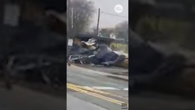 Tractor-trailer stuck on tracks slammed by oncoming train | USA TODAY #Shorts