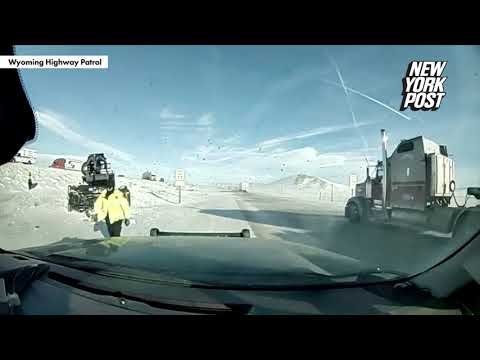 WATCH: Officer’s narrow escape from truck skidding off snow-caked highway | New York Post