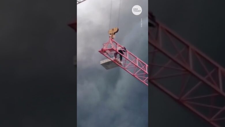 Worker trapped over construction fire rescued using crane | USA TODAY #Shorts