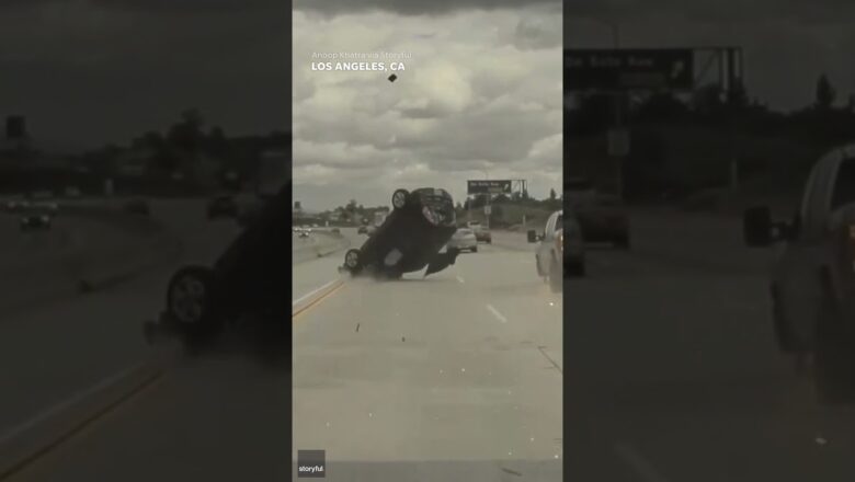 Car sent flying into air after running over tire that had fallen off truck #Shorts