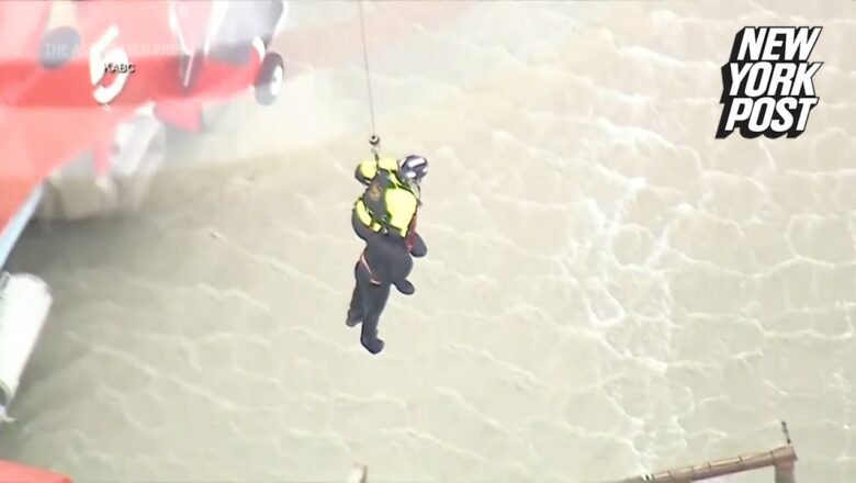 Heart-stopping moment man is rescued by helicopter from raging LA river | New York Post