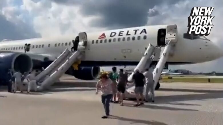 Dramatic video captures passengers evacuating Delta flight after tire blows and burst into flames