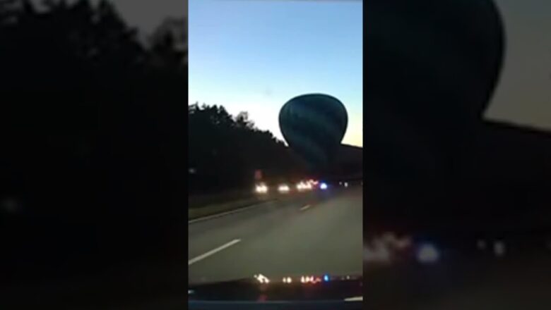 Hot air balloon carrying passengers safely lands on busy highway #Shorts