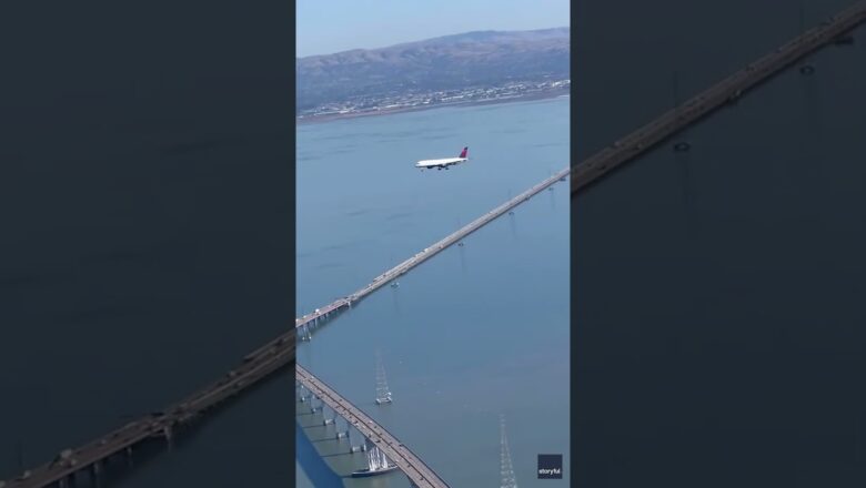 Watch: Illusion of plane makes it look like it’s hovering above bridge #Shorts