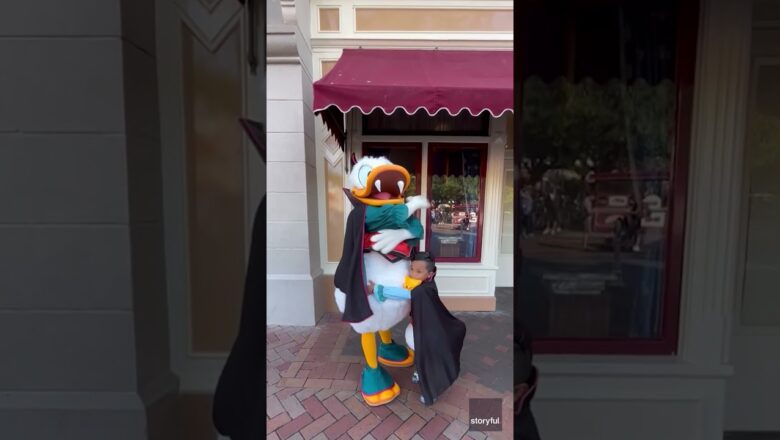 Young fan shakes a tail feather with his favorite, famous Disney duck #Shorts