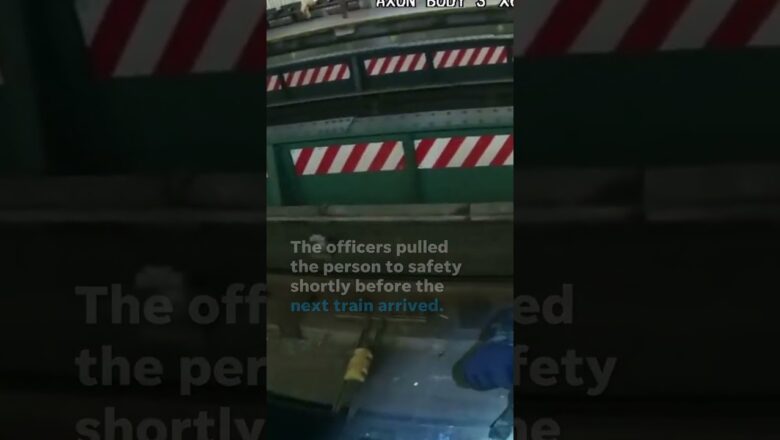 NYPD officers rescue person from subway tracks before train arrives #Shorts