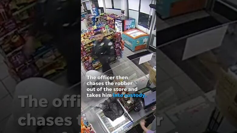 Police officer unknowingly interrupts a robbery in progress #Shorts