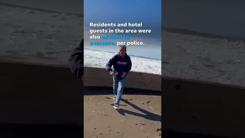 Watch: Rogue wave jumps seawall and injures eight #Shorts