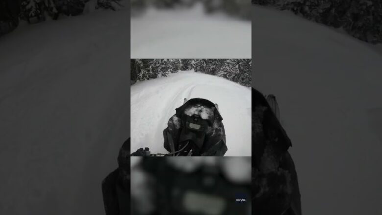 Watch: Moment snowmobiler is temporarily buried in avalanche #Shorts