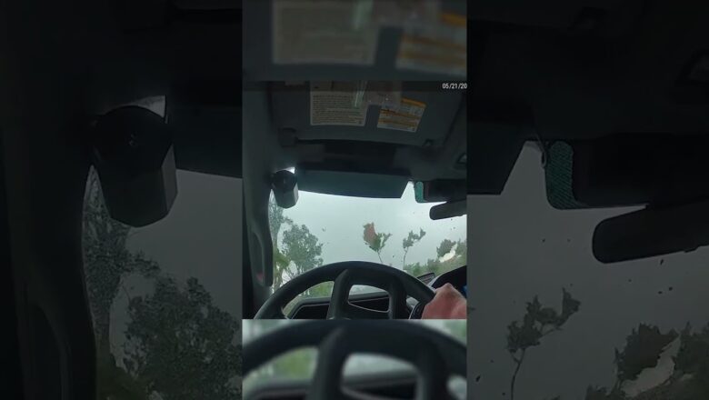 Watch: Twister roars over officer in his cruiser #Shorts