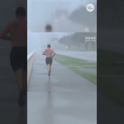 Unbothered Florida man jogs through Hurricane Milton broadcast #Shorts