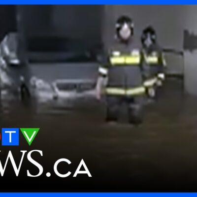 Car with driver inside pulled from severely flooded road in Florence, Italy