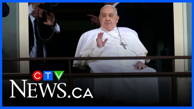 Pope Francis makes his first appearance to crowds outside the hospital