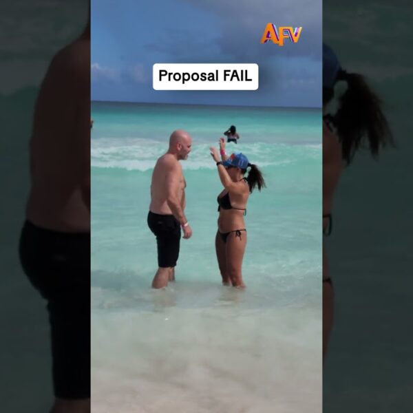 The wave said no but she said yes! 💍 #afv #proposal #fail #shorts