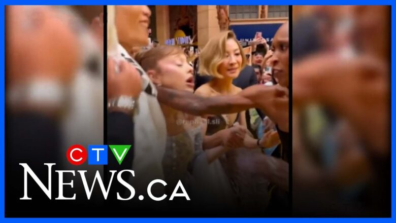 Ariana Grande grabbed by prankster at movie premiere in Singapore