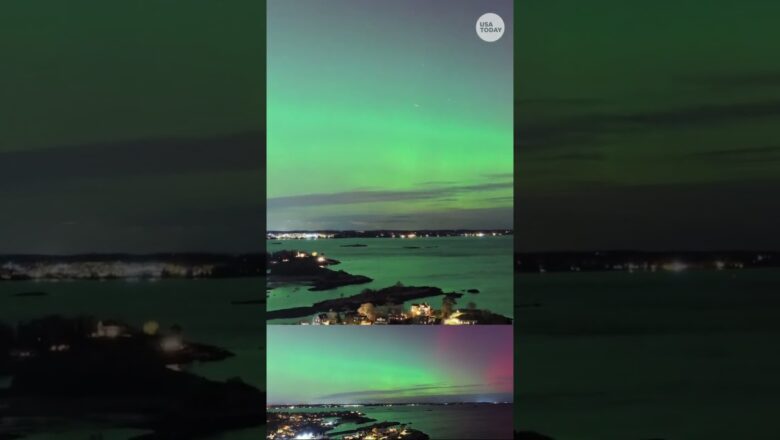 Drone shows stunning aurora over seaside town