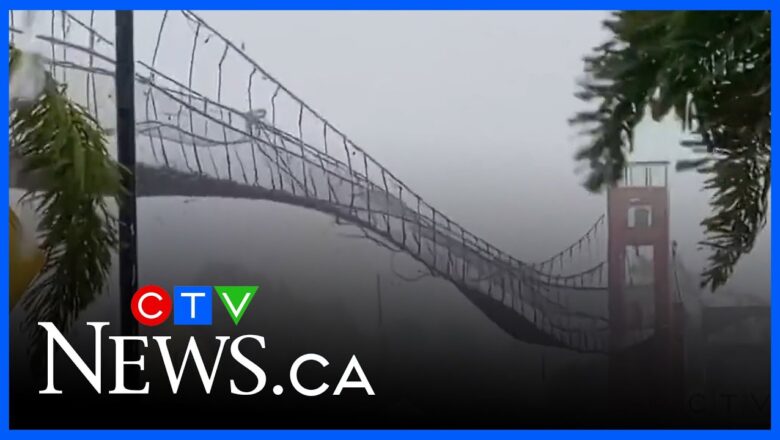 Suspension bridge swings wildly as Typhoon Fung-wong hits the Philippines