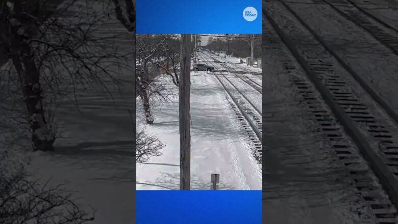 Train smashes through car at crossing in Chicago suburb