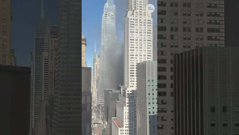 Firefighters battle fire at Manhattan building