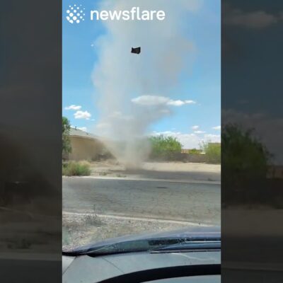 Huge Dust Devil Forms Outside Mans House