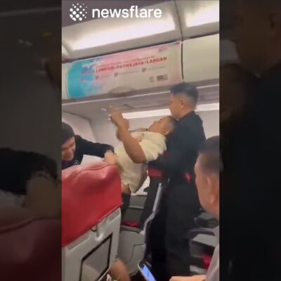 Plane Passenger Attempts To Open Plane Doors MID FLIGHT