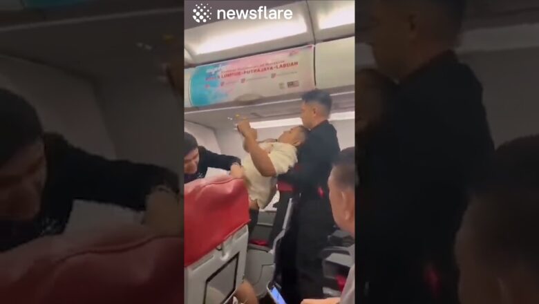 Plane Passenger Attempts To Open Plane Doors MID FLIGHT