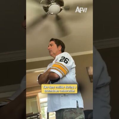 Two fans collide during a touchdown celebration 🏈
