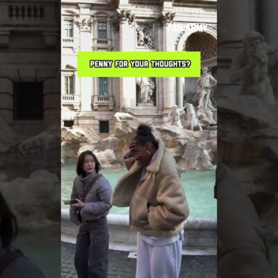 Woman Accidentally Gets Hit by Coin While Posing Near Fountain