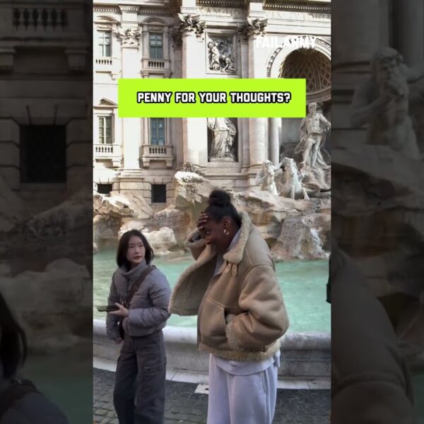 Woman Accidentally Gets Hit by Coin While Posing Near Fountain